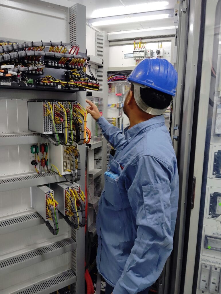 electrician working on an electrical panel
